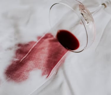 A red wine stain on a white fabric 