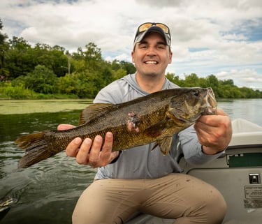 John with a streamer eating smallmouth