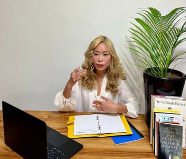 Renee Lin providing one-on-one career coaching at her desk