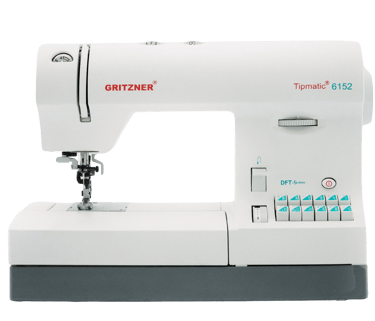 a sewing machine with a white sewing machine