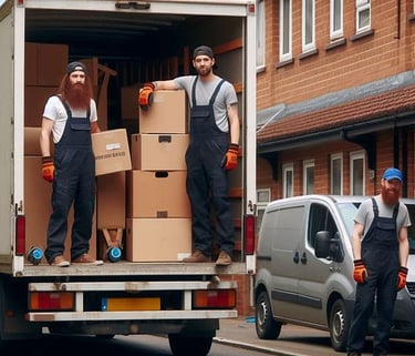 3 man and a van removal crew packing a large van with boxes