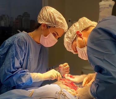 a man and woman in scrubs are performing surgery