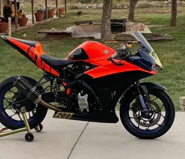 black and red race motorcycle. yamaha with matte black and red wrap. wrapped