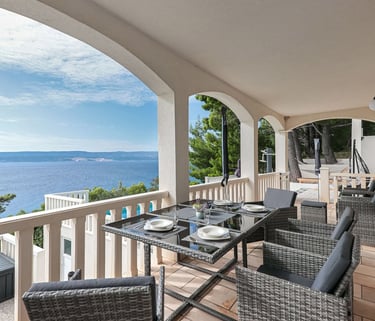 The photo shows an apartment balcony and a part of the pool. 