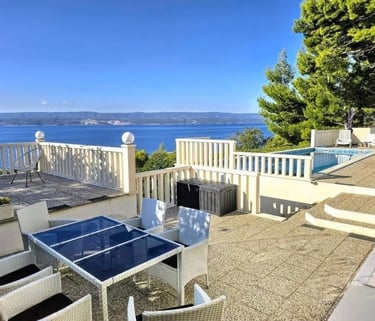 East side of the courtyard by the pool with a dining table and open sea views, Easy Living, Lokva Rogoznica