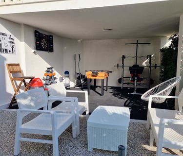 The photo shows an outdoor Fun and Fitness area with home equipment.
