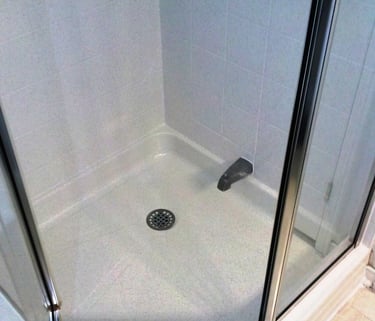 Shower stall resurfaced in white sands maintenance free finish