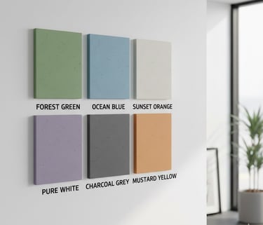 Six textured wall paint color samples displayed on a white wall in a modern room interior.
