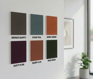 Six earth-tone interior paint color swatches displayed on a modern white wall.