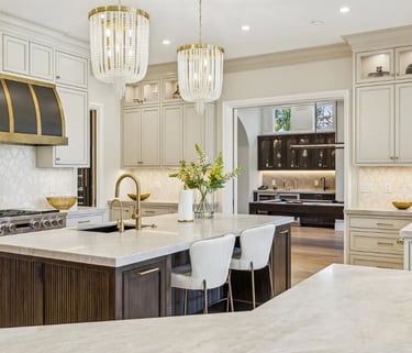 Kitchen remodel with an island, seating, pendant lighting, and surrounding cabinetry.