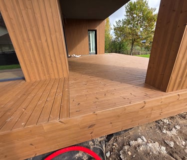 a wooden deck with a red circle in the middle