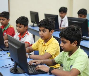 A group of enthusiastic children working together on a robotics project with colorful circuits and laptops in a bright classroom.