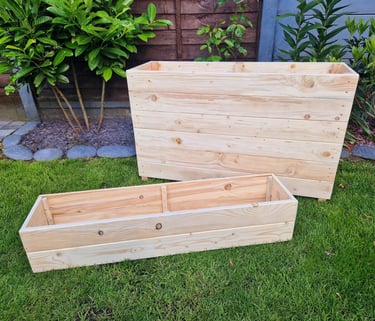 quality planters and plant boxes made from solid wood handmade in uk large and tall wooden troughs