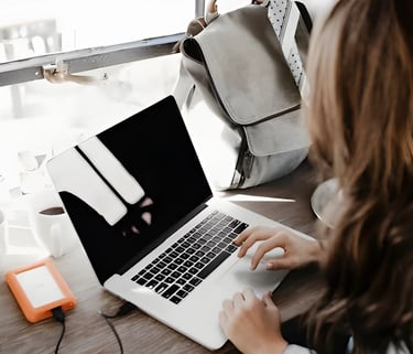 Hands typing on a laptop, symbolizing end-to-end assistance by Admit 360 for studying abroad,