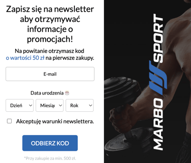 a man holding a dumb dumbble in front of a banner