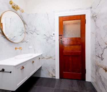 white and gold renovated bathroom