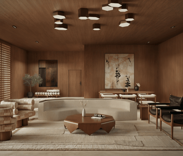 A living room with wood walls and ceiling, a curved beige sofa, and patterned armchairs