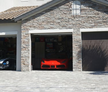 Modern residential garage design featuring desert-resilient stone masonry and premium finishes.