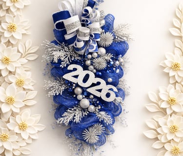 Festive 2026 New Year decorative door swag featuring blue mesh, silver glitter ornaments, and ribbons.