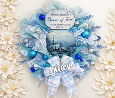 Thomas Kinkade blue Christmas wreath with ornaments, a snowy church scene, and a Believe sign.