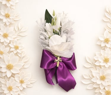Elegant white floral lapel pin with a purple satin ribbon and gold cross for religious ceremonies.