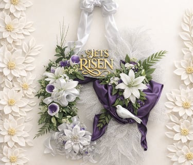 Elegant Easter wreath with white lilies, purple silk ribbon, and He Is Risen gold signage.