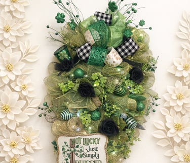 St. Patrick's Day door swag with green mesh, shamrocks, black roses, and a Not Lucky Just Simply Blessed sign.