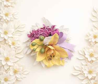 Yellow orchid and purple flower corsage on a white background with decorative floral borders.