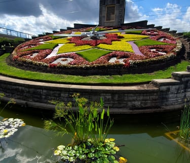 A picture of the flower clock under a partly cloudy sky.