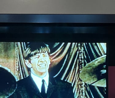 A picture of the Rock and Roll Hall of Fame exhibit on the Beatles.