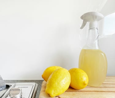 Lemons and a spray bottle full of DIY cleaner