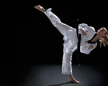 taekwondo high kick by girl in style