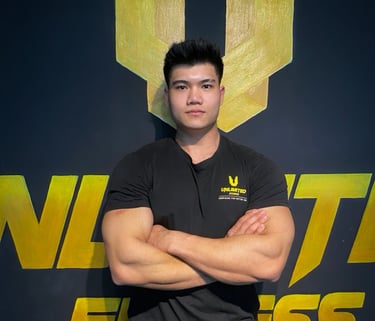 a man in a black shirt and tan pants