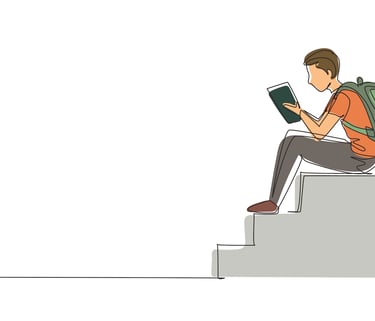 teenager reading book on steps