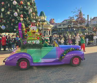 Donald Duck driving his car at Disney stars on parade show at Christmas time in Disneyland Paris 