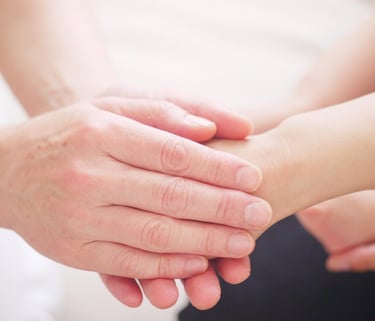 Holding hands for comfort and prayer