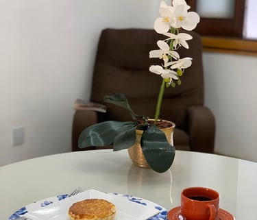 a table with a cup of coffee and a cup of coffee