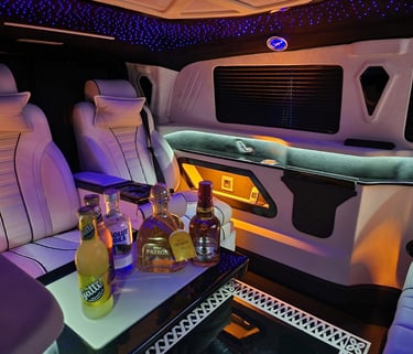 Luxury Transfer Van Interior With Premium Seating And Refreshments