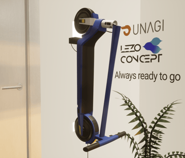 a blue scooter with a plant in the background