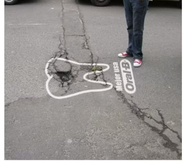Oral-B guerrilla marketing campaign in Quito Ecuador using a street crack shaped as a decayed tooth