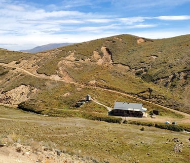 Woolshed Hut with the 4WD track in background