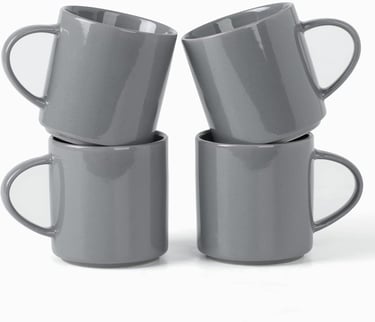 Set of four stackable grey ceramic coffee mugs with a glossy finish and speckled detail on a white background.