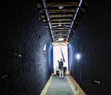 Blackened walkway leading to the exhibition