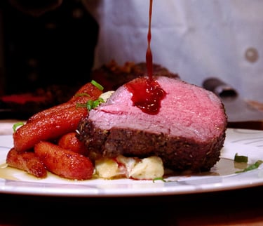 Sauce poured on rare steak