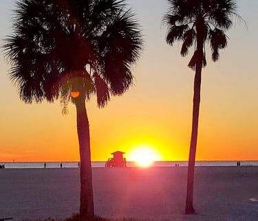 sunset on Siesta Beach at the yellow lifeguard tower
