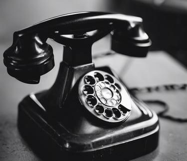 Black and white image of a vintage telephone