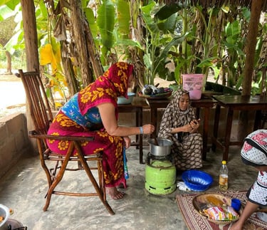 Tourist participating in a step-by-step cooking class coached by a local guide during a luxury Zanzibar spice tour, learning