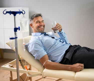 a man in receiving an IV drip to help restore his health