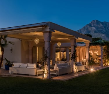 Dusk view of the lounge and seating areas at Villa El Rincon