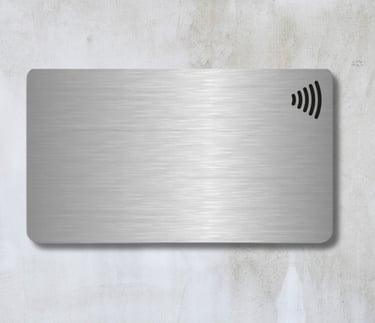 a metal NFC card with a wireless logo on top. made in paranaque